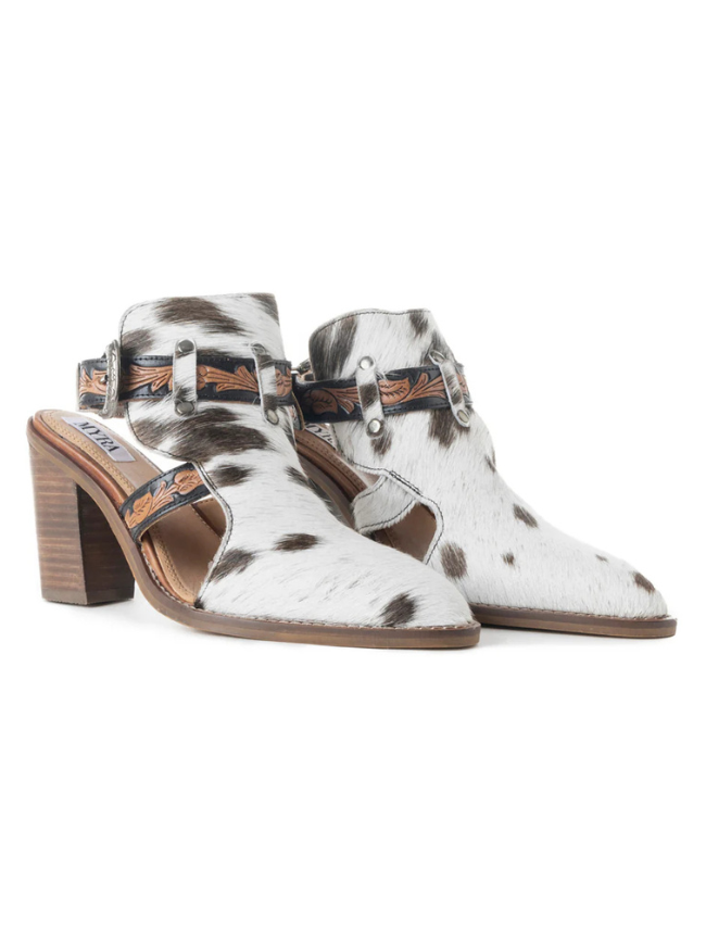 White cowhide leather ankle booties with brown block heel on a white background