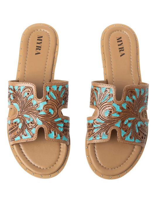 Pair of tan sandals with turquoise tooled designs on a white background