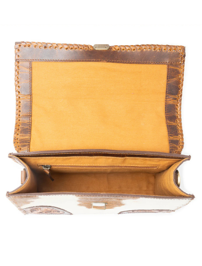 Inside view of a structured brown hair-on leather hand bag 