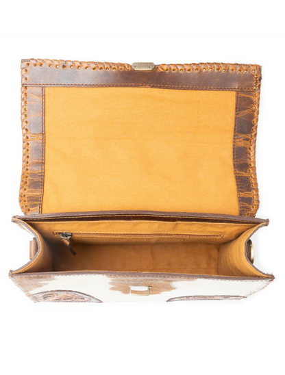Inside view of a structured brown hair-on leather hand bag 