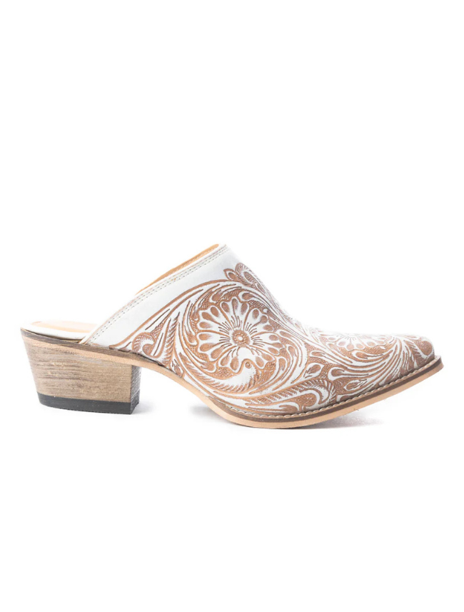Beige slip-on mules with white paisley pattern on a white background
