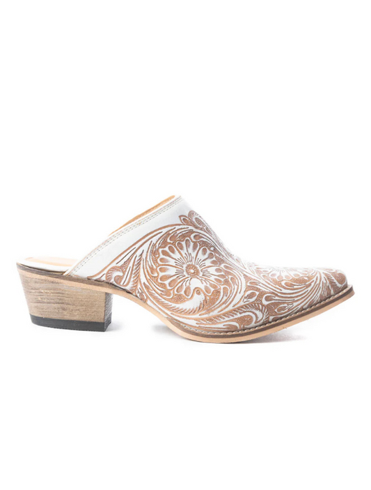 Beige slip-on mules with white paisley pattern on a white background