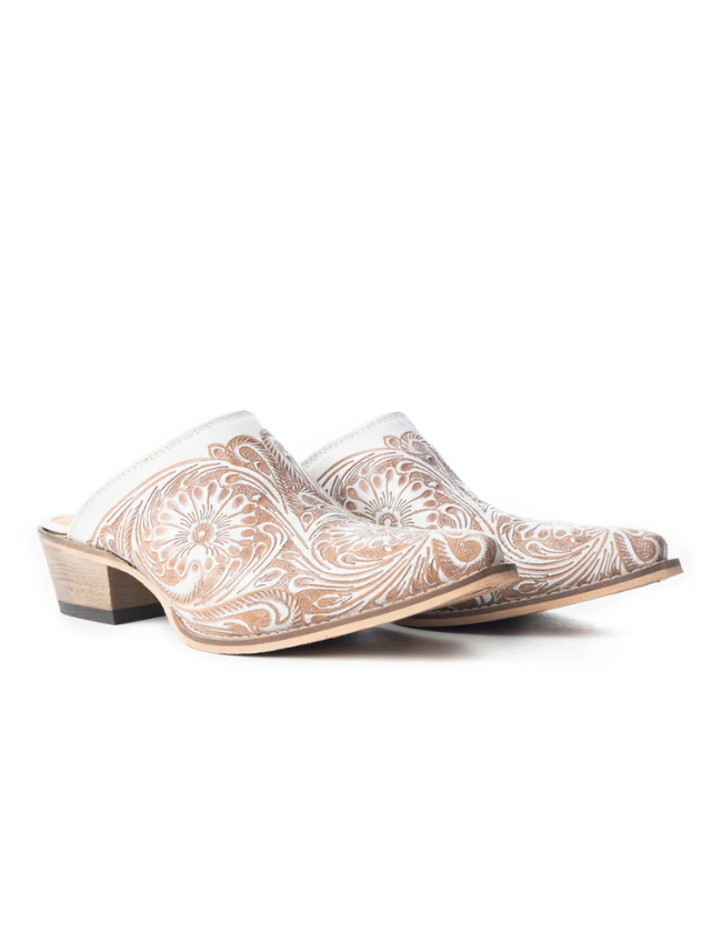 Pair of beige mules with white paisley pattern on a white background