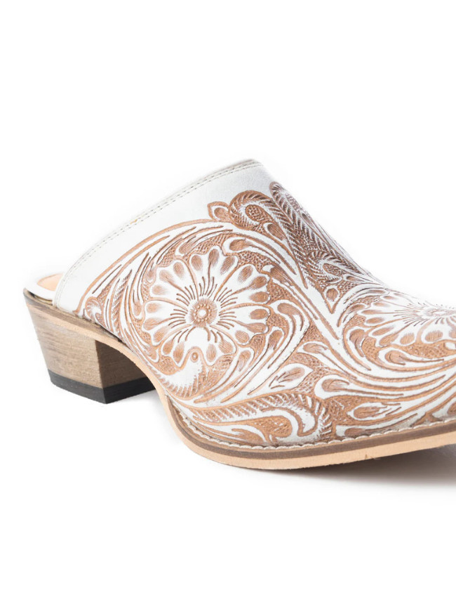 Beige mules with intricate white paisley patterns on a white background