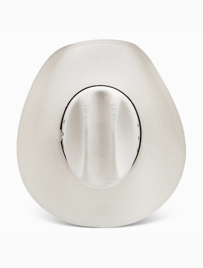 White straw cowboy hat with a brown band on a white background