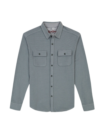 Blue textured shirt with two chest pockets on a white background