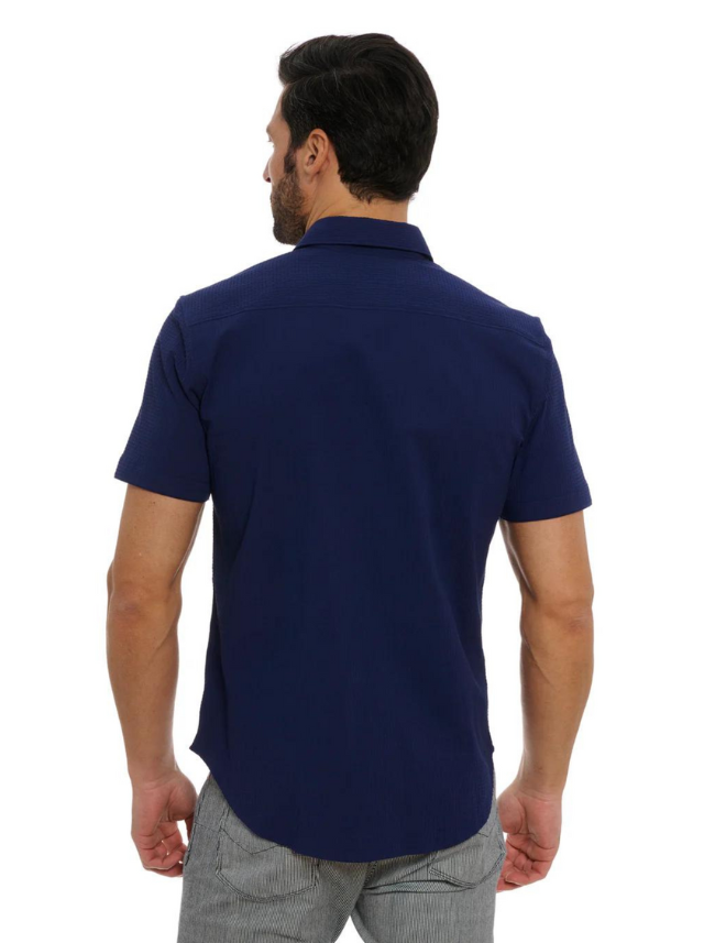 Man wearing a navy blue polo shirt on a white background