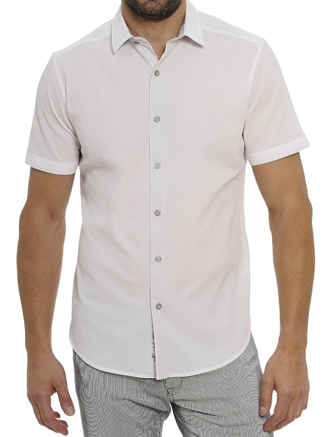 Man wearing a light gray short-sleeve button-up shirt on a white background