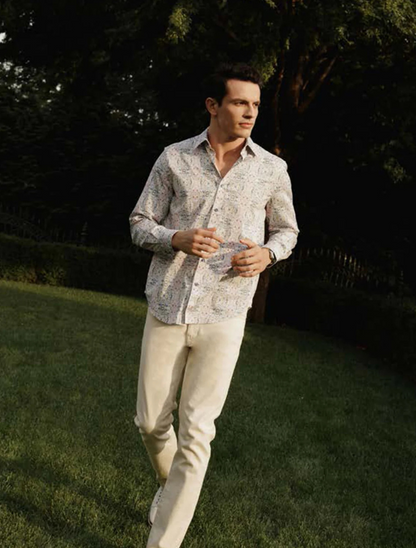 Model wearing Robert Graham Gomera Long Sleeve Shirt – bold floral print button-down styled for upscale casual or resort wear