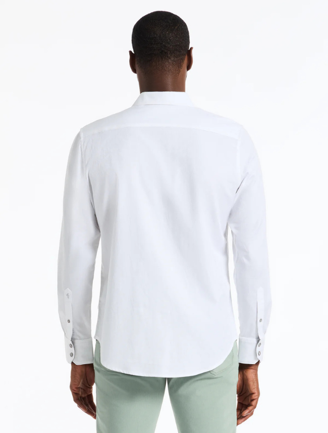 Back view of a man wearing a white long-sleeve shirt on a white background