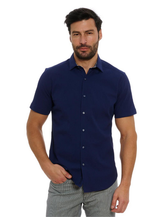 Man wearing a navy blue short-sleeve shirt on a white background