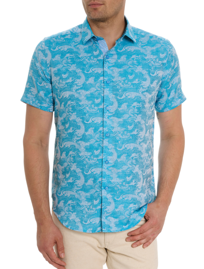 Man wearing a turquoise patterned shirt on a white background