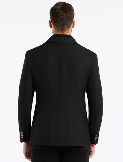 Man wearing a black suit jacket on a white background