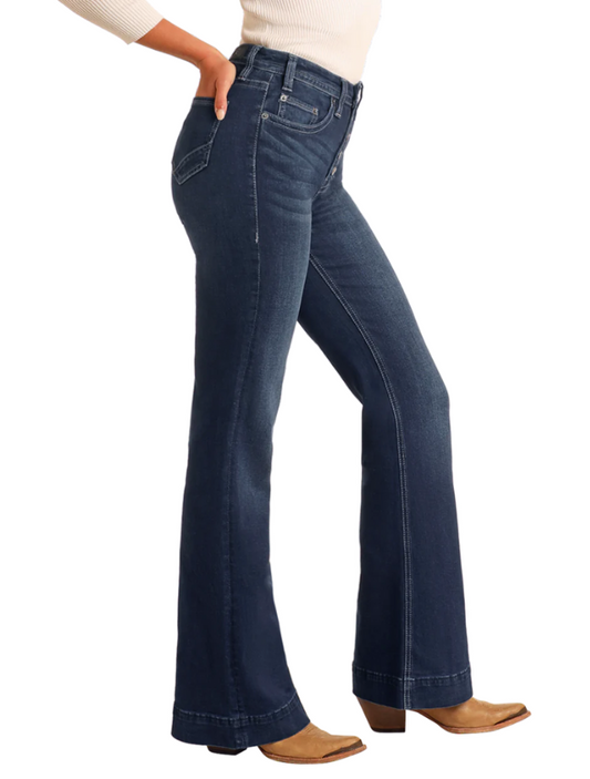 Blue jeans worn by a person on a white background