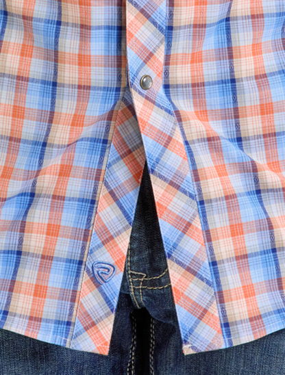 Front, close up view of the Rock & Roll Denim Men's Yarn Dyed Dobby Plaid Long Sleeve Western Snap Shirt with emphasis on the orange dobby plaid and blue brand emblem