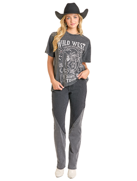 Woman wearing a 'Wild West' t-shirt and gray pants with a cowboy hat on a white background