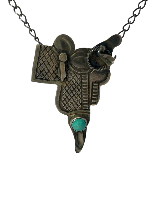 Front, close up of Sterling Silver Saddle Necklace with single turquoise cabochon