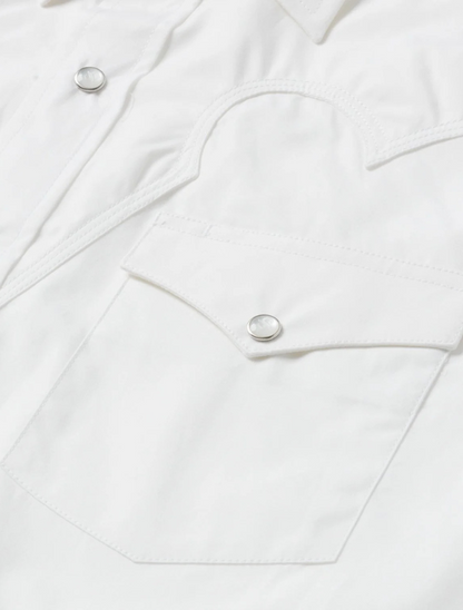 Close-up of a white shirt with button details