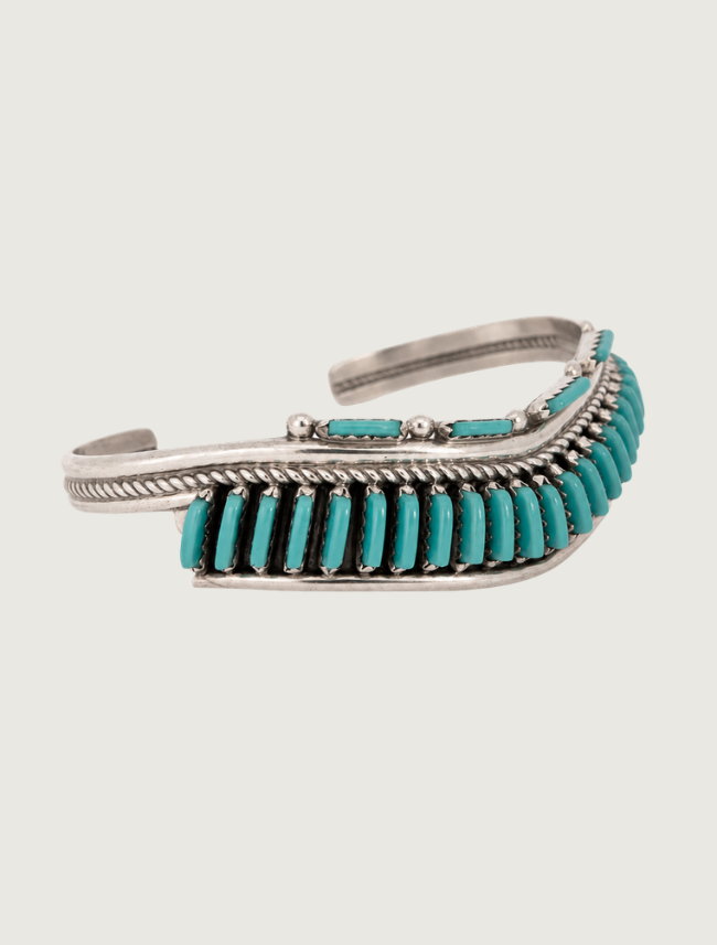 Quarter view of sterling silver Sleeping Beauty turquoise needlepoint cuff bracelet
