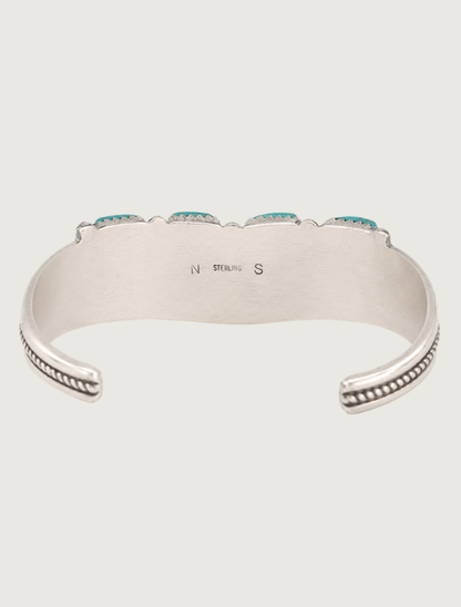 Interior view of sterling silver Sleeping Beauty turquoise needlepoint cuff bracelet with hallmark "NS" and "STERLING" present