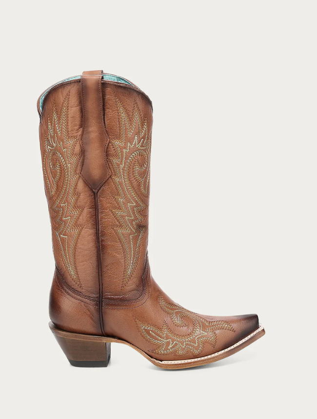 Brown cowboy boot with intricate stitching on a white background