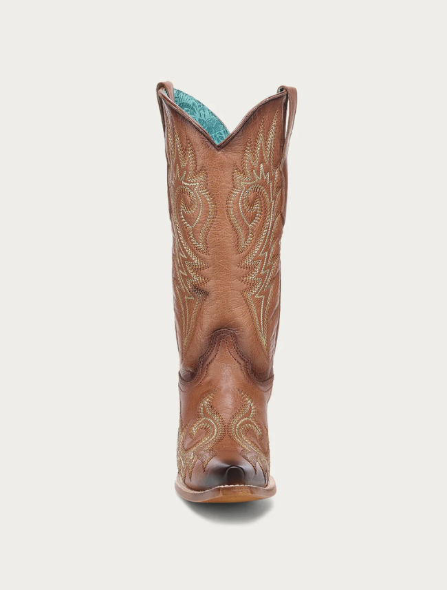 Brown cowboy boot with turquoise interior on a white background